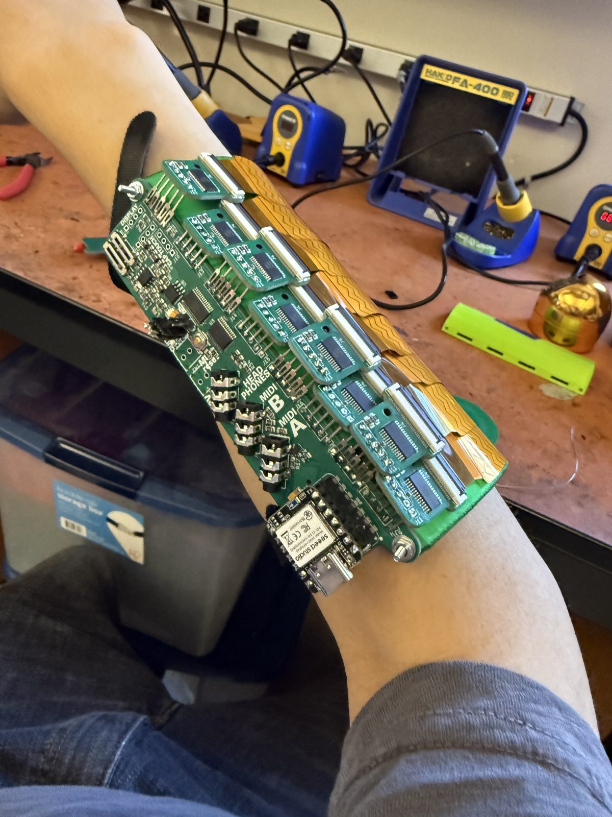 On the arm at the bench