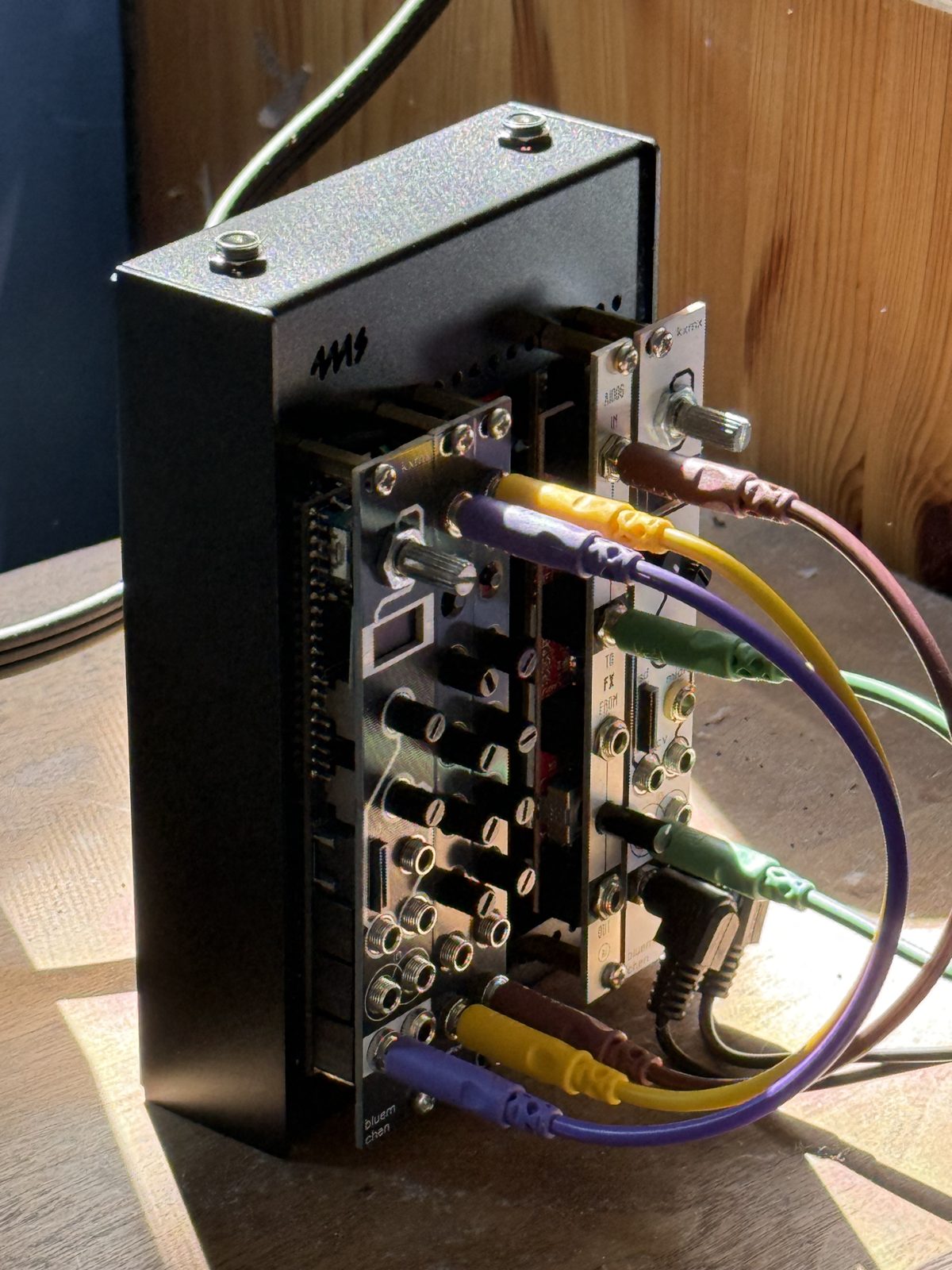 The rack on its side, patch cables in